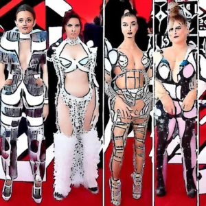 Artistic representation for In a chip suit and no dress : the strangest looks of stars at the MTV awards . Photojournalist's eye reveals the fashion faux pas